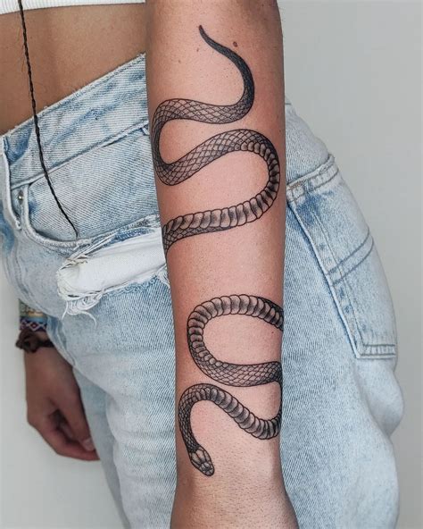 Wrap around snake tattoo arm